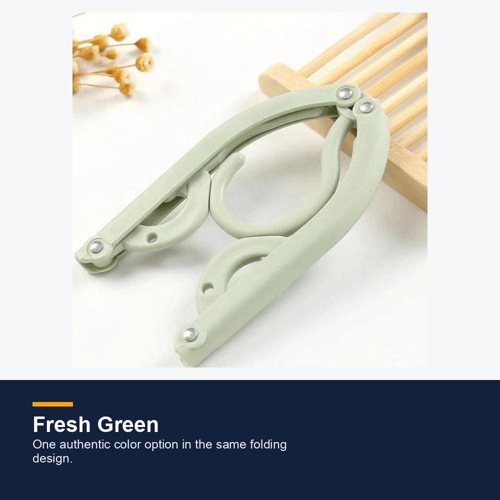 Green compact folding travel hanger