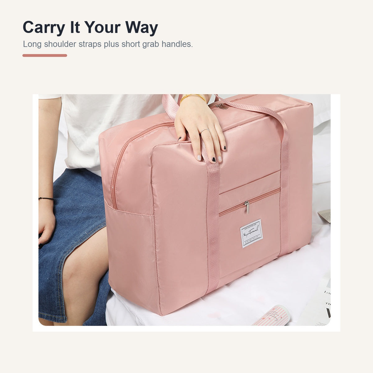 Pink medium travel duffel with shoulder and grab handles